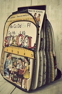 back to school book bags are stacked on top of each other, with children's drawings painted on them