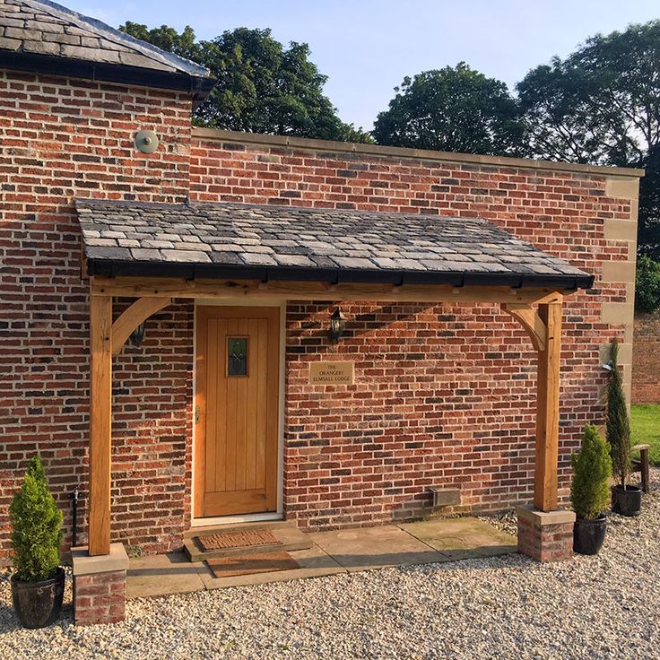 a small brick building with a wooden door