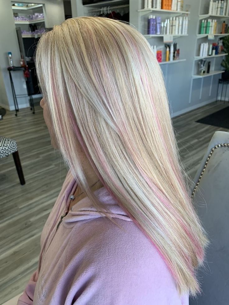 Pink In Blonde Hair Subtle, Blonde And Pink Extensions, Light Pink On Blonde Hair, Platinum With Pink Highlights, What Colors Look Good With Blonde Hair, Blonde Hair With A Pink Streak, Pastel Pink Streaks In Blonde Hair, Platinum Hair With Pink Highlights, Blond With Pink Streaks