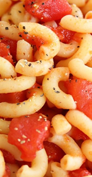 pasta with tomatoes and black pepper sprinkled on top