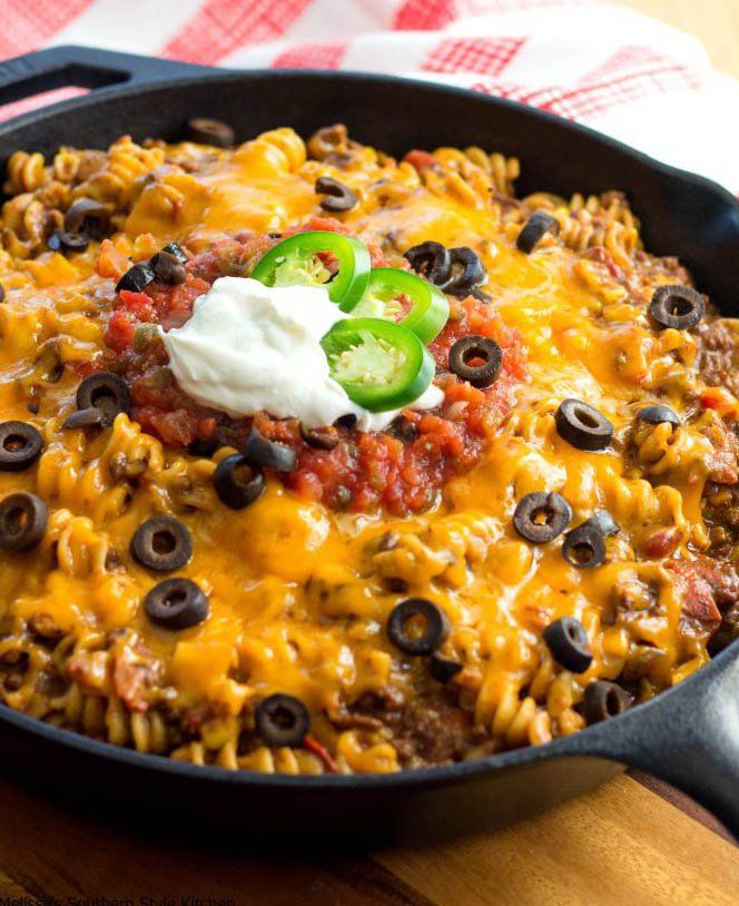 cheesy nacho beef rotini skillet with sour cream and jalapenos