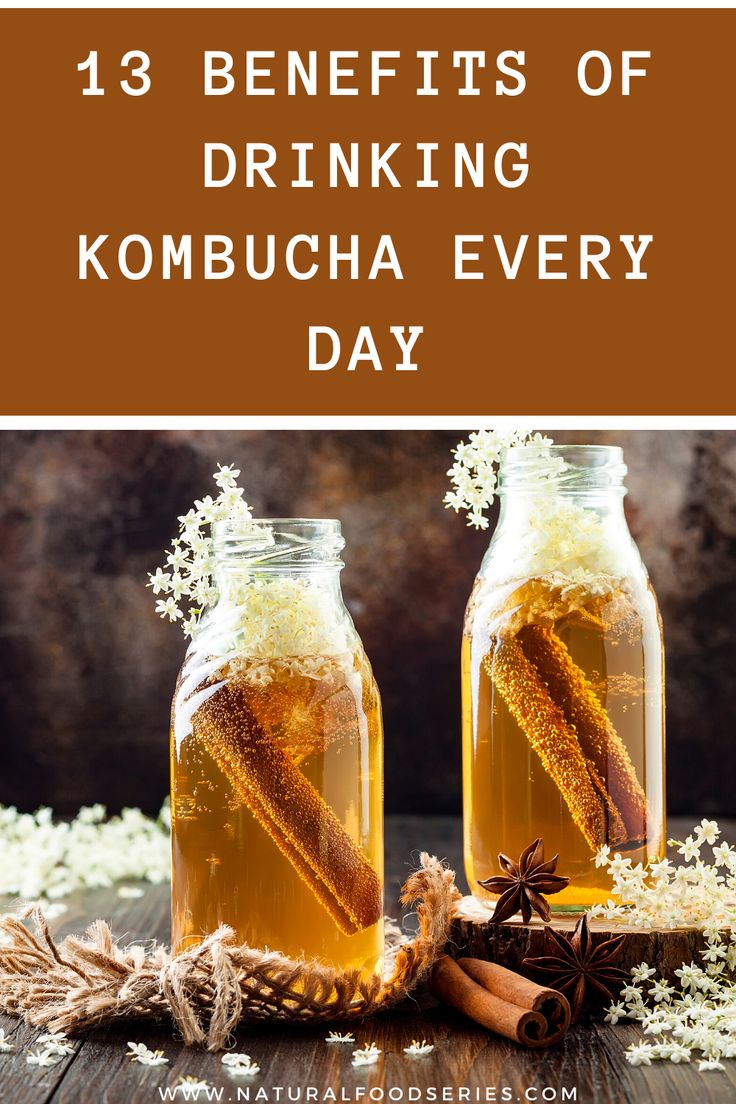 two mason jars filled with kombucha and cinnamon sticks