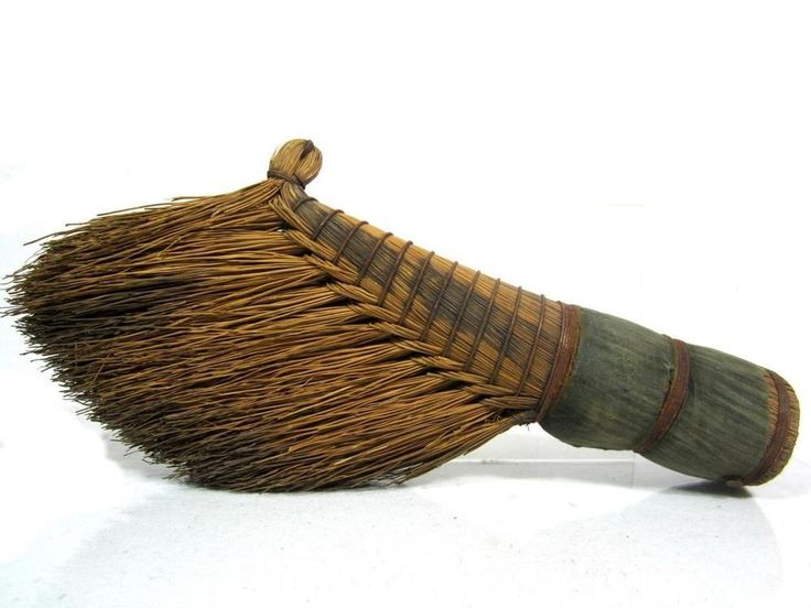 a close up of a broom on a white background