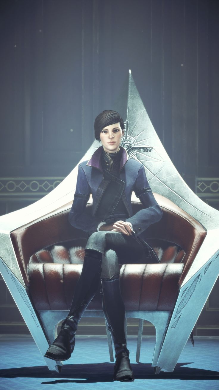 a woman sitting on top of a chair in front of a star shaped object with her legs crossed