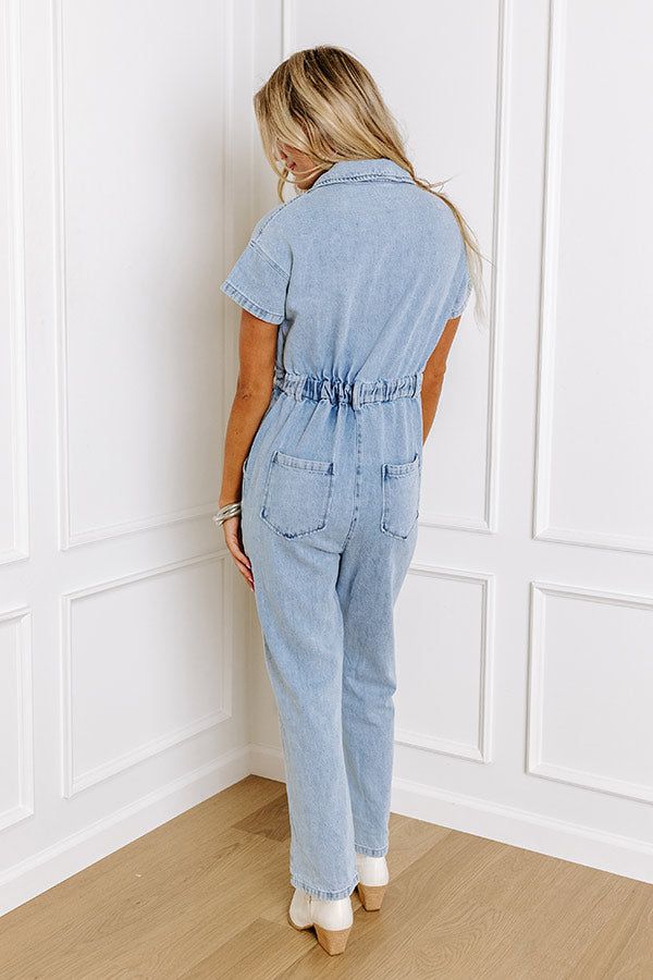 Jump into trendy style with this denim jumpsuit! Unlined denim material - A collared v-cut neckline that goes into a button-up bodice - Short sleeves - A functional chest pocket - A waistline with an elastic back, belt loops, a hidden zip fly, and button closure - Functional side and back pockets - A relaxed silhouette that ends in ankle length hemlines Denim Material, Trendy Style, V Cut, V Cuts, Denim Jumpsuit, Chest Pocket, Ankle Length, Trendy Fashion, Bodice