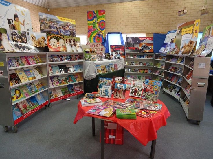 the children's book store is full of books and toys for sale on tables