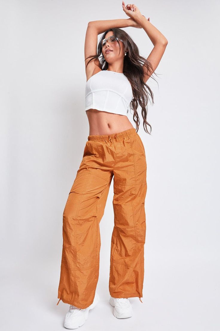 Sunset Stretch Nylon Wide-leg Parachute Pants, Sporty High-waisted Parachute Pants With Loose Fit, Wide Leg Nylon Pants For Streetwear, Wide-leg Nylon Pants For Streetwear, Sporty Solid High-waisted Parachute Pants, Sporty High-waisted Parachute Pants, Fall Wide Leg Nylon Bottoms, Wide Leg Nylon Bottoms For Fall, Relaxed Fit Wide Leg Nylon Parachute Pants