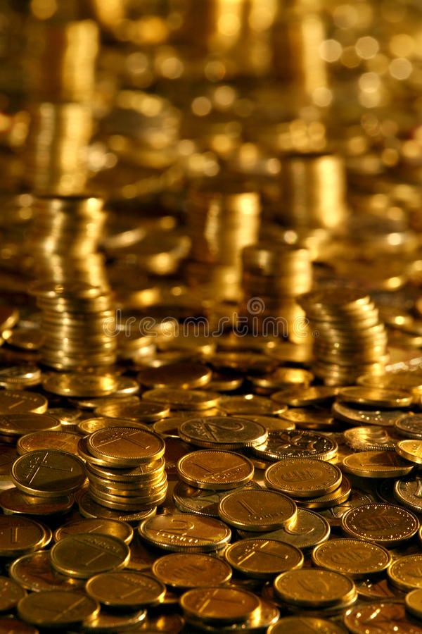 gold coins are stacked on top of each other