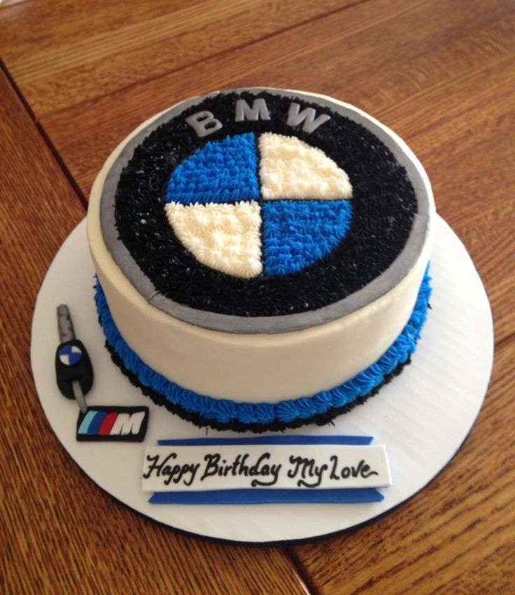 a birthday cake with the bmw logo on it