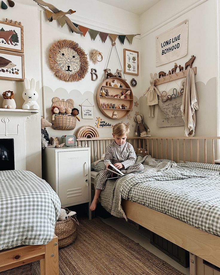 a young child sitting on a bed reading a book in a bedroom decorated with teddy bears