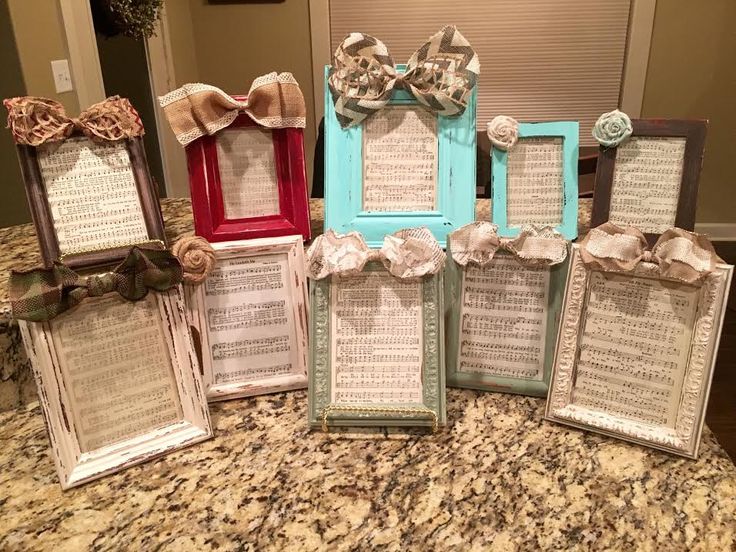 there are many frames that have been decorated with ribbons and bows on the top one