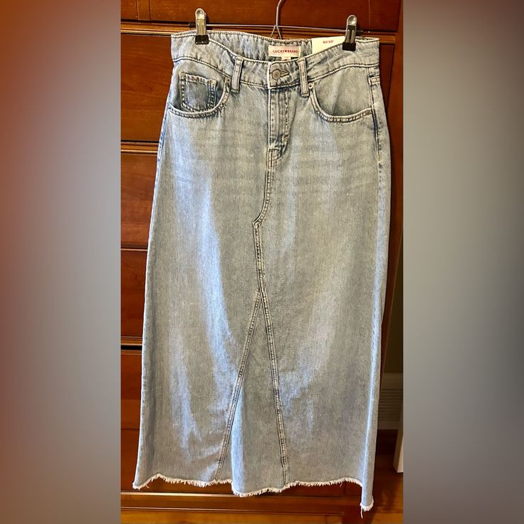 A Classic Closet Staple, This Denim Maxi Skirt Features 5-Pocket Styling With Button And Zip Fly, Belt Loops And A Raw Edge Frayed Hem. Nwt Size 2/26 Approximate Flat Measurements: Waist - 15 Inches Length - 38.5 Inches Nwt Size 6/28 Approximate Flat Measurements: Waist - 16 Inches Length - 38.5 Inches Trendy Light Wash Denim Skirt With Pockets, Spring Medium Wash Denim Skirt With Five Pockets, High-waisted Light Wash Denim Skirt With Pockets, High Waist Light Wash Denim Skirt With Pockets, Light Wash Denim Skirt With Pockets For Spring, Trendy Washed Blue Denim Skirt With Pockets, Spring Light Wash Denim Skirt With Pockets, Mid-rise Denim Skirt With Pockets, Medium Wash, Mid-rise Denim Skirt With Pockets In Medium Wash