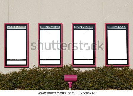 three pink chairs sitting in front of a white building with black and red signs on it