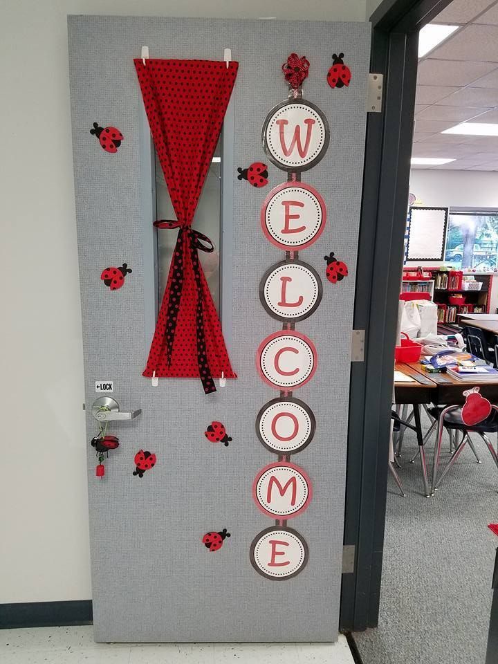 a door decorated with ladybugs and welcome sign