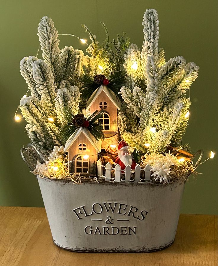 a potted plant with lights in it that says flowers and garden on the side