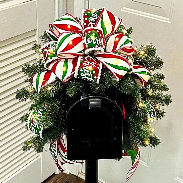 a mailbox decorated with candy canes and lights