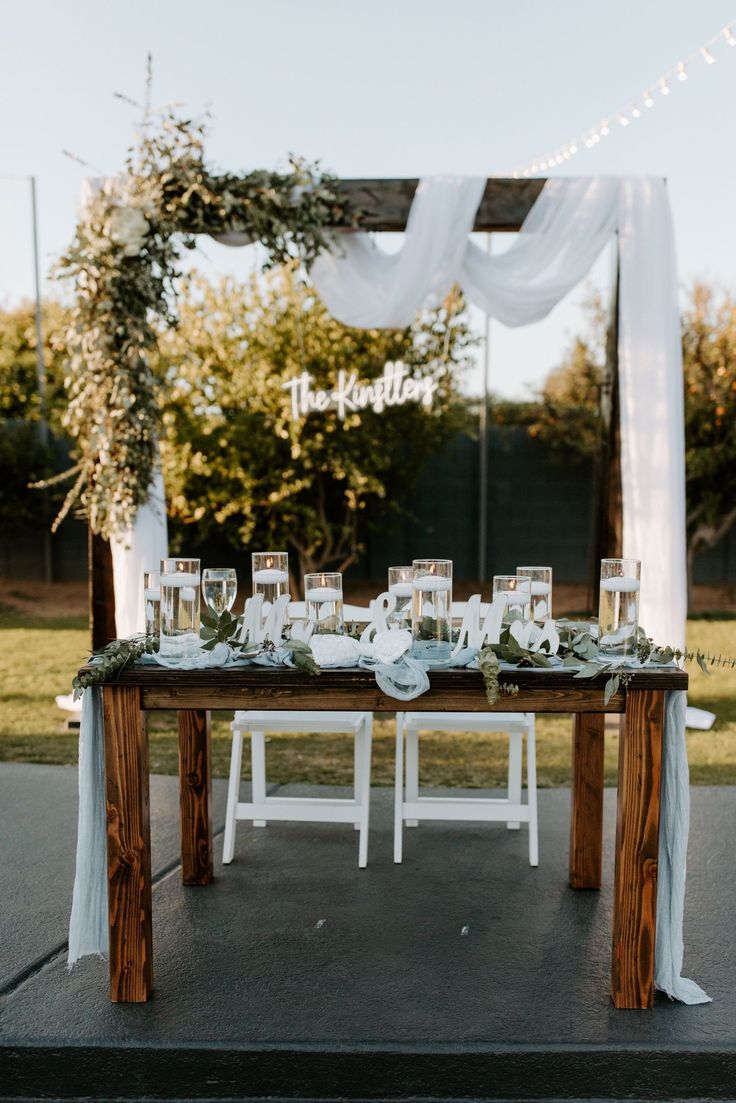 the table is set up with place settings for guests to sit down and enjoy their meal