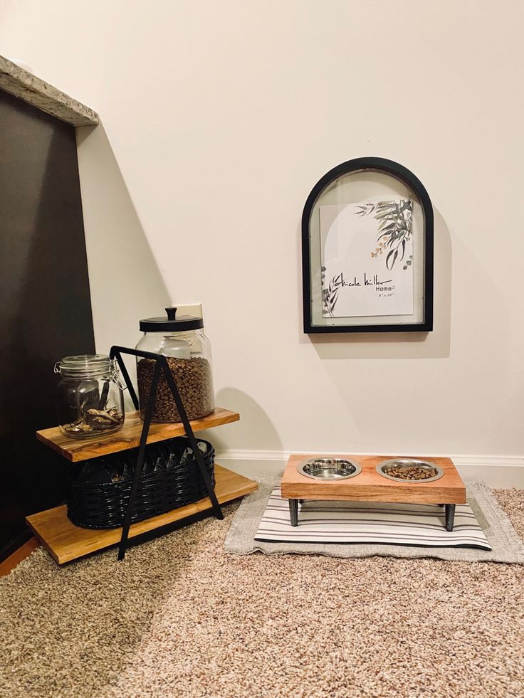 there is a coffee maker and tray on the floor in this living room with white walls