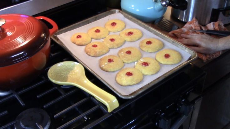 a pan filled with cookies sitting on top of a stove