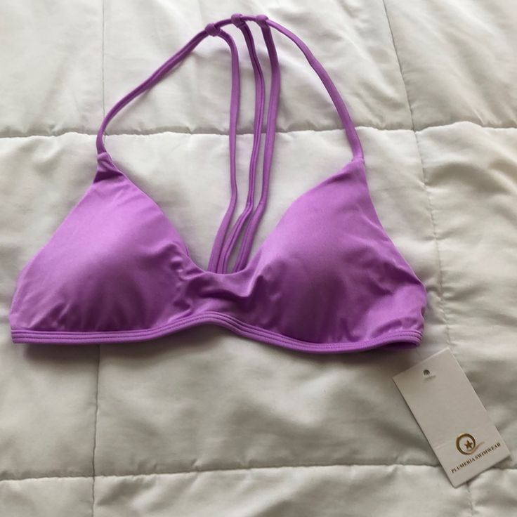 Nwt. Never Worn. Trouble In Paradise. Lilac Jewel. Removable Pads. Multiple Loop Holes In Strap For Adjustment. Vertical Spaghetti Straps Are Moveable. Matching Bottoms In A Separate Listing. Bundle To Save. Beach Bra With Adjustable Straps And Stretch, Beach Underwire Stretch Bra, Strappy Seamless Beach Bra, Seamless Strappy Halter Top For The Beach, Strappy Seamless Bra For Beach, Seamless Strappy Bra For Beach, Purple Triangle Halter Top For Beach, Vacation Bra With Straps, Underwire Halter Top For Beach