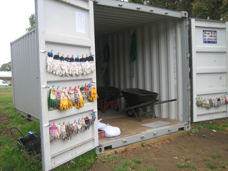 a storage container with clothes hanging from it