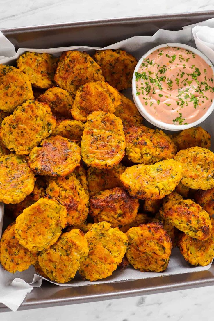 homemade broccoli pumpkin tots in a box with dipping sauce