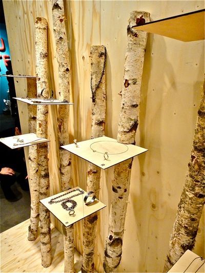 there are many different types of trees in the room that is made out of plywood