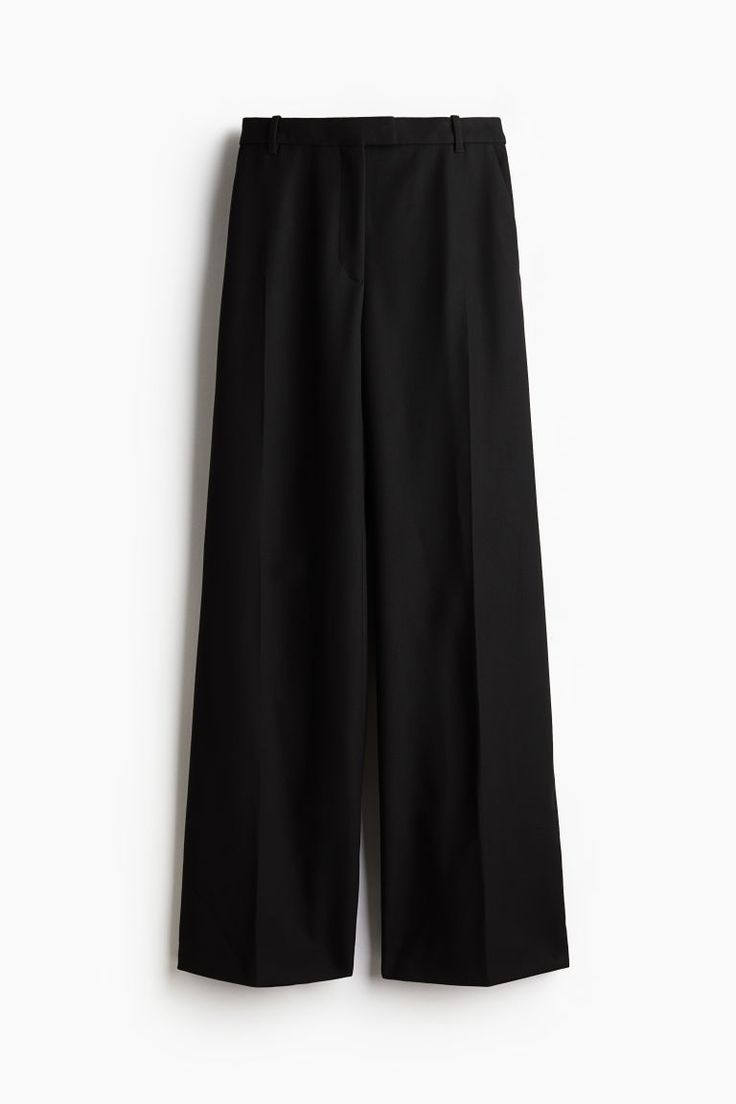 Dress pants in woven fabric. Extended waistband tab with hook-and-bar fastener and zip fly with concealed button. Diagonal side pockets  welt back pockets  and flared legs with creases at front and back. Flared Pants, Flare Pants, Dress Pants, Black Pants, Woven Fabric, Black Women, H&m, The Selection, Bar