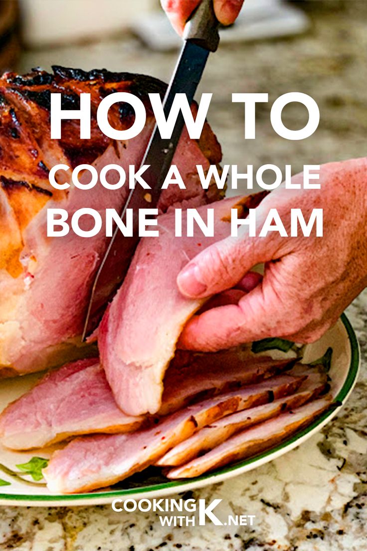 a person cutting meat on top of a plate with the words how to cook a whole bone in ham