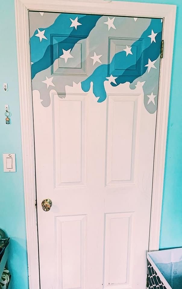 a white door with stars painted on it