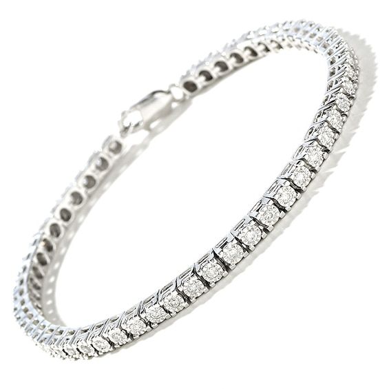 Illuminate her wrist with the lavish look of this classic 1 ct. t.w. diamond sterling silver tennis bracelet. Crafted in sterling silver Shimmering diamonds - each artfully set to enhance size and sparkle - line this classic design. Look great solo or layered with other bracelets Captivating with 1 ct. t.w. of diamonds This 7.0-inch bracelet secures with a lobster claw clasp. Exquisite Platinum Tennis Bracelet With Diamond Accents, Elegant White Tennis Bracelet With Single Cut Diamonds, White Gold Tennis Bracelet With Diamond Accents, Dazzling White Sterling Silver Tennis Bracelet, Fine Jewelry Sterling Silver Bracelet With Prong Setting, Fine Jewelry Cubic Zirconia Tennis Bracelet, Classic Diamond Tennis Bracelet With Accents, Dazzling White Gold Tennis Bracelet In Platinum, Elegant Tennis Bracelet With Diamond Accents