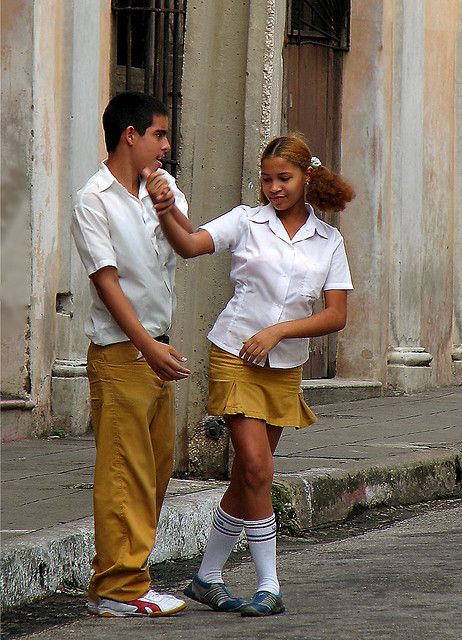 a man standing next to a woman on the street