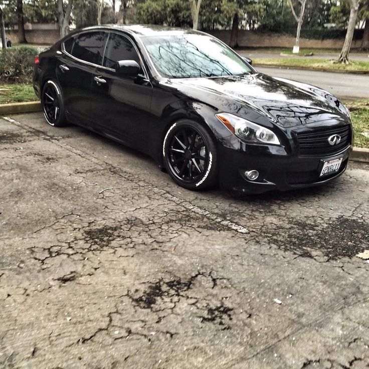 a black car parked in a parking lot