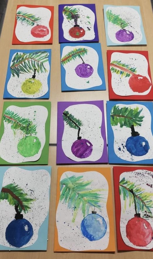 the children's art project is made with colored paper and watercolors, which are