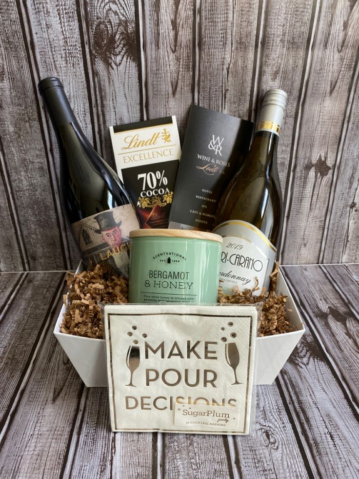 a wine gift box filled with wines and snacks