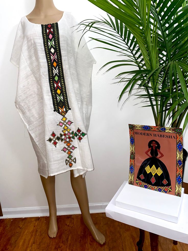 White Folk Habesha Kemis For Traditional Ceremonies, White Bohemian Kaftan For Traditional Ceremonies, White Bohemian Ceremonial Dress, White Bohemian Dress For Ceremonial Use, Folk Style White Habesha Kemis For Festival, White Bohemian Dress For Ceremonial Occasions, White Habesha Kemis For Festival, White Traditional Tunic For Festival, Traditional White Short Sleeve Tunic