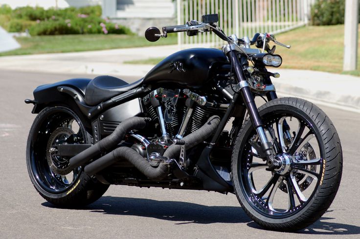 a black motorcycle is parked on the street