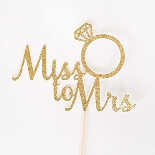 a cake topper that says miss and mrs on it with a diamond in the middle