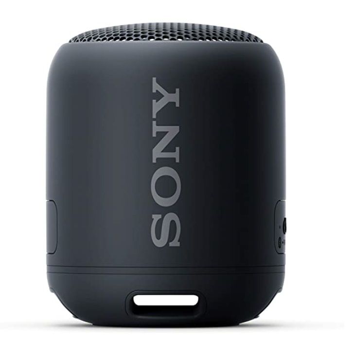 the sony portable bluetooth speaker is black and has white letters on it's side