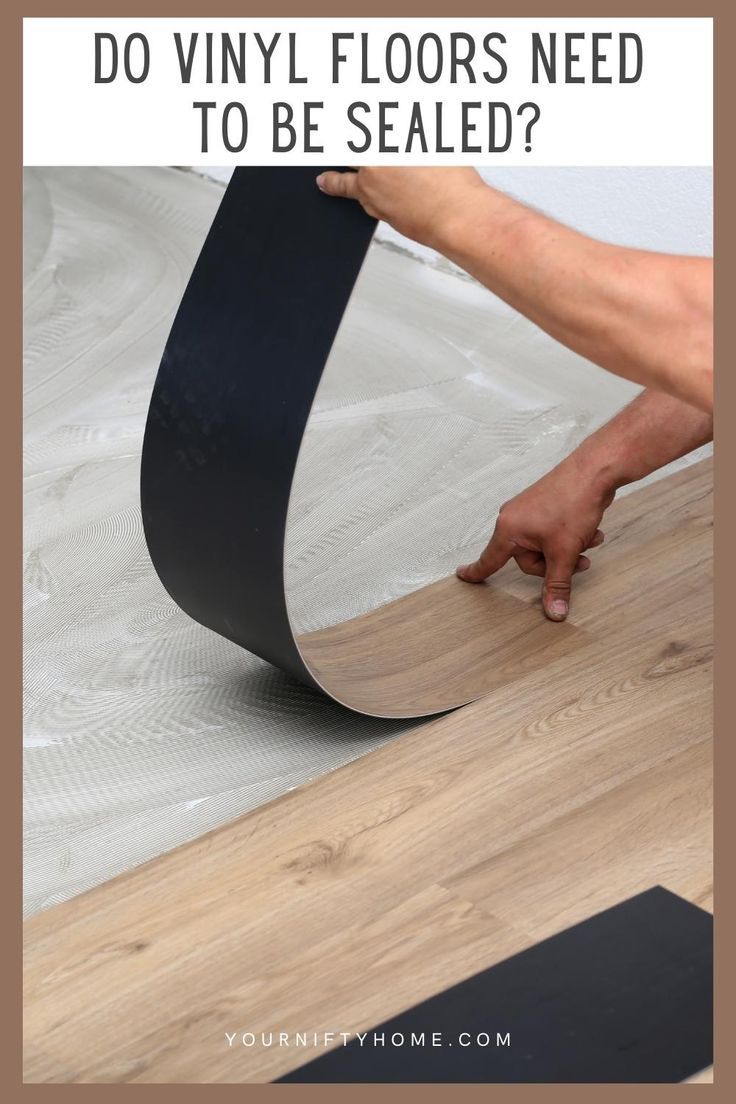 a person laying on top of a wooden floor with text overlay that reads do vinyl floors need to be sealed?