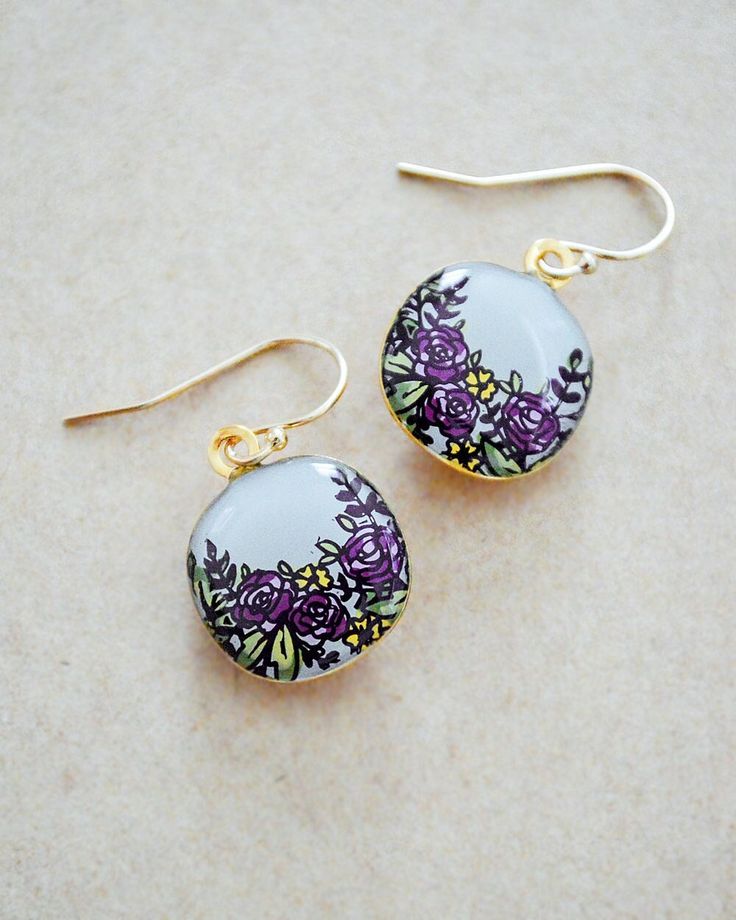 Wearing these Cosmos flower painted earrings are an instant mood boost making them the perfect gift to give yourself or someone special! These dangle style drop earrings are 14K Gold Filled and lightweight, making them comfortable for sensitive ears and all day wear. Hand painted with a special enameling and stencil technique, so while there may be small variations your pair will look very much like these shown here. ITEM DETAILS * Flowers are painted on a Gold plated bezel, approx 1/2 inch roun Dangle Flower Earrings With Floral Print For Gift, Hand Painted Dangle Flower Earrings For Gift, Dangle Flower Earrings With Floral Print As Gift, Floral Print Dangle Earrings For Gift, Floral Print Earrings For Gift, Floral Print Drop Earrings As Gift, Floral Print Earrings For Gifts, Elegant Hand Painted Earrings As Gift, Elegant Hand Painted Earrings For Gift