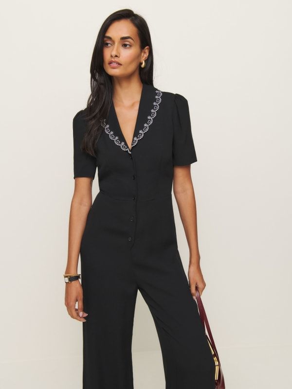 One and done. Shop the Erin Jumpsuit from Reformation, a short-sleeve jumpsuit with a relaxed wide leg, V-neckline, and button front. Elegant Short Sleeve Formal Jumpsuits And Rompers, Fitted V-neck Jumpsuits And Rompers With Buttons, Summer Workwear Jumpsuits With Short Sleeves, Elegant Black Short Sleeve Jumpsuits And Rompers, Fitted Short Sleeve Jumpsuit With Buttons, Elegant V-neck Jumpsuits And Rompers For Daywear, Fitted Short Sleeve Jumpsuit With Button Closure, Elegant V-neck Jumpsuits And Rompers With Buttons, Elegant V-neck Jumpsuit Or Romper With Buttons