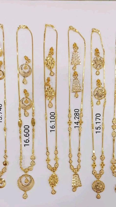 gold necklaces are displayed in rows and sizes