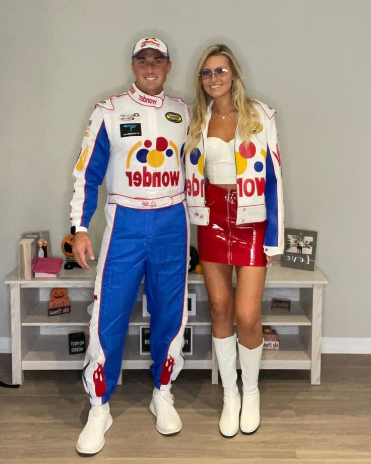 the man and woman are dressed up as race cars driver and racing car driver,