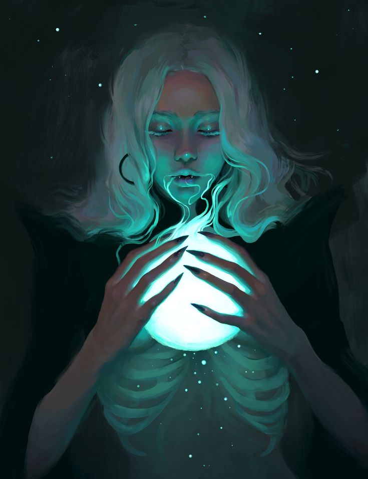 a woman holding a glowing ball in her hands