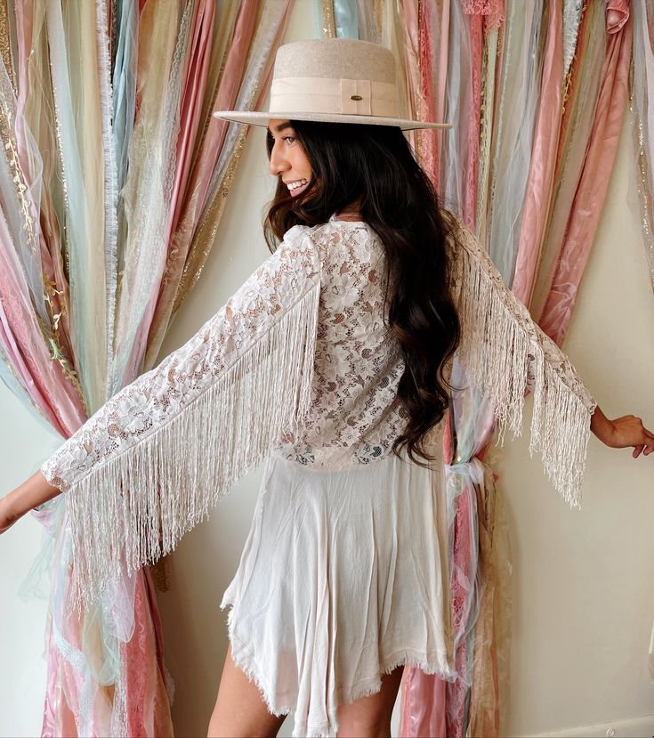 Color is a pale blush. This boho tunic is super lightweight and absolutely gorgeous with the fringe detailing on the arms and the lace throughout the top side of the tunic. •I recommend sizing up in this tunic for the best fit. Bohemian Tops With Lace Sleeves For Fall, Long Sleeve Fringe Tops For Festivals, Bohemian Long Sleeve Fringe Blouse, Bohemian Long Sleeve Blouse With Fringe, Spring Bohemian Embroidered Lace Top, Bohemian Lace Top For Party, Bohemian Fringe Blouse For The Beach, Bohemian Fringe Blouse For Beach, Spring Festival Lace Top With Crochet Trim