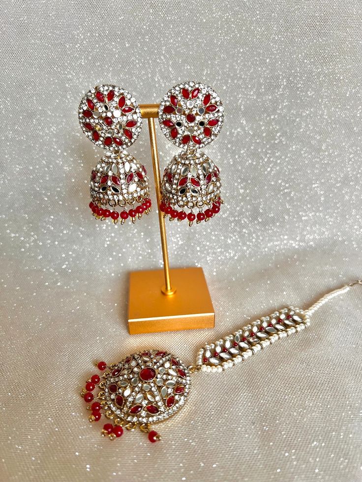 Mirror Polki Jhumkas With Tikka - Etsy Red Earrings For Puja And Festivals, Traditional Red Tikka As Gift, Red Hand Set Chandbali Jhumkas, Red Chandbali Hand Set Jhumkas, Red Chandbali Jhumkas With Hand Set, Festive Red Jhumkas With Stone Work, Red Hand Set Temple Jewelry Earrings, Red Tikka With Tilla As Gift, Red Temple Jewelry Earrings With Hand Set Details