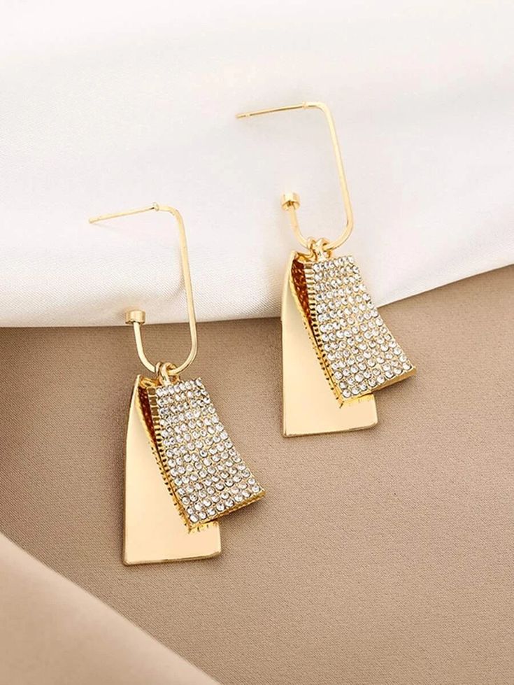 Make a statement with these eye-catching What Do You Want Earrings. Designed with sophistication in mind, these geo drop earrings will be the perfect accessory for your next date night. Crafted with elegance, these classy earrings will give your look a unique flair. Height 2.4"Width 0.6" Due to monitor differences, actual colors and/or patterns may vary slightly from online. Modern Metal Teardrop Earrings For Party, Chic Crystal Drop Earrings, Chic Teardrop Earrings For Party, Geometric Gold Earrings For Party, Gold Geometric Earrings For Party, Chic Dangle Hoop Earrings For Evening, Metal Linear Drop Earrings For Evening, Metal Drop Earrings For Evening, Modern Chandelier Drop Earrings For Party