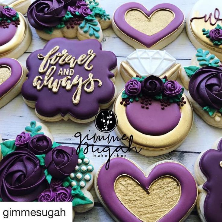 purple and gold decorated wedding cookies are arranged on a white wooden table with the words great and chubbys written in cursive