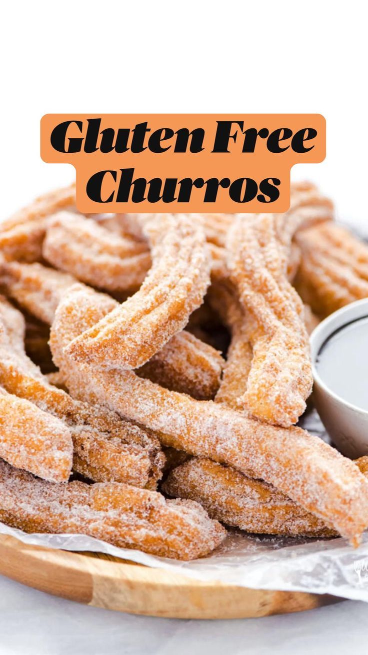 gluten free churros on a plate with dipping sauce in the background